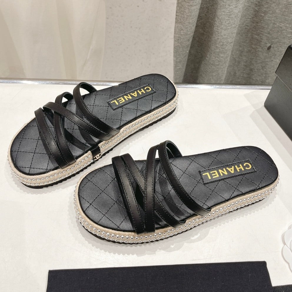 Chanel Slippers Cross Straps in Black Lambskin