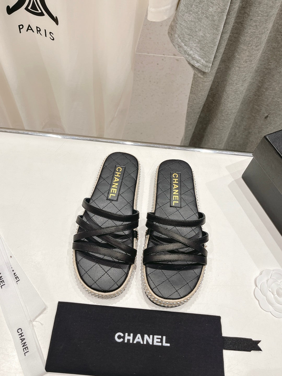 Chanel Slippers Cross Straps in Black Lambskin