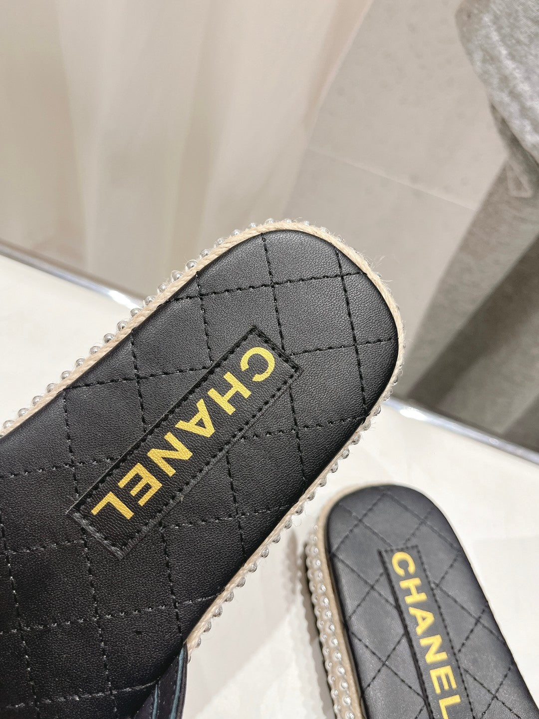 Chanel Slippers Cross Straps in Black Lambskin