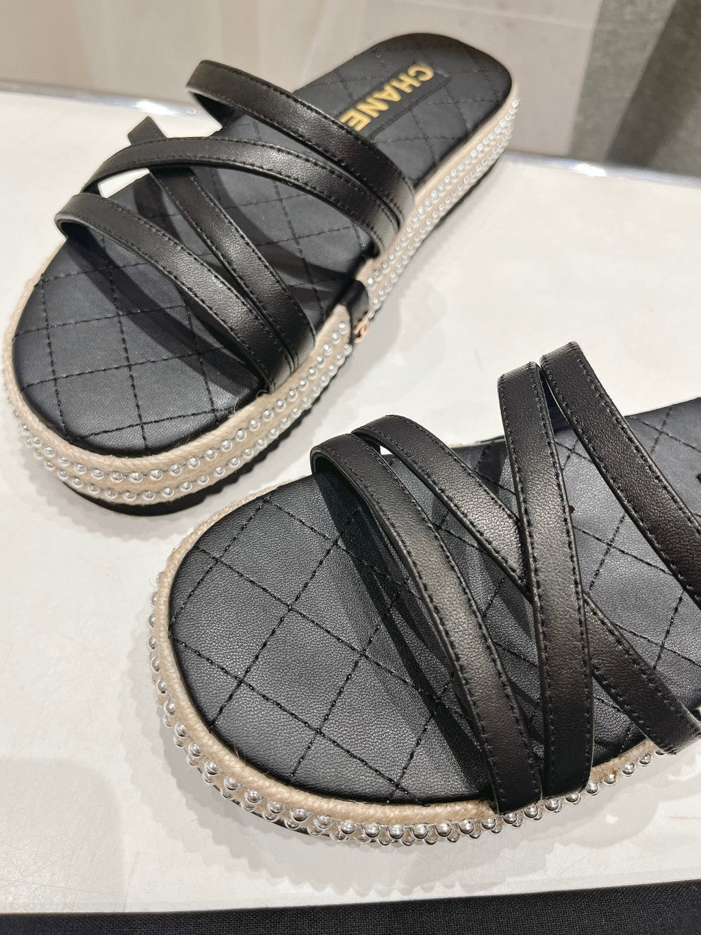 Chanel Slippers Cross Straps in Black Lambskin