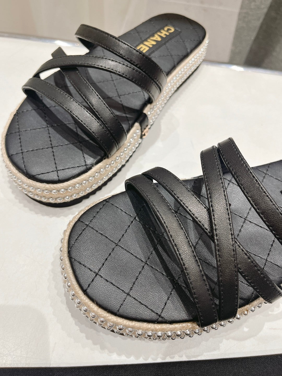 Chanel Slippers Cross Straps in Black Lambskin