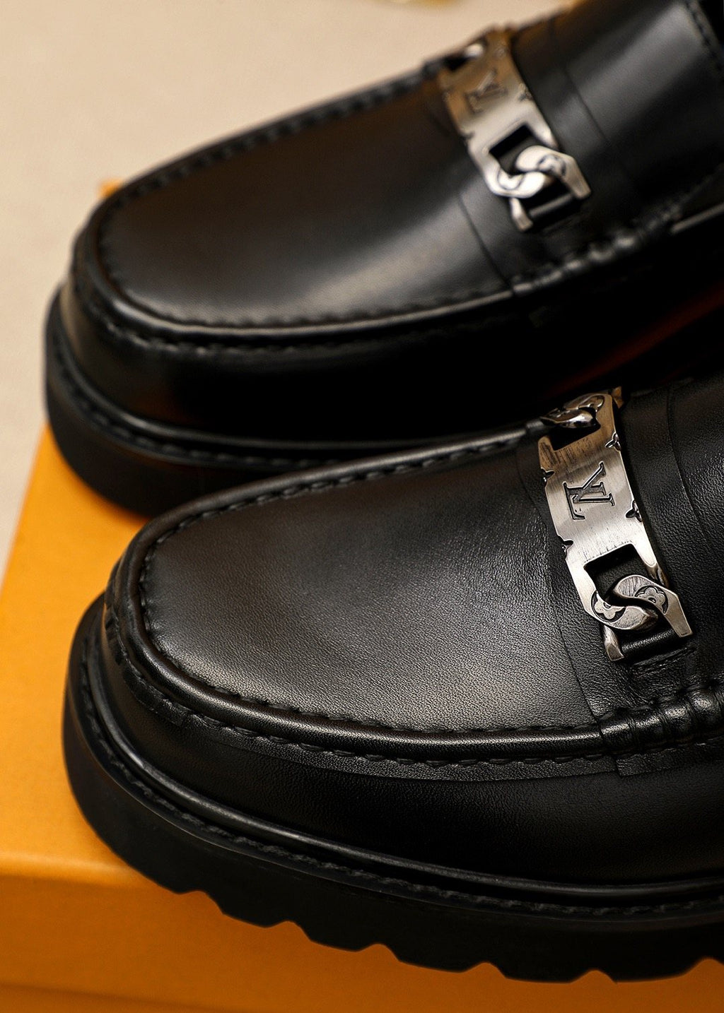 Louis Vuitton Black Metal-Bit Loafers — detail