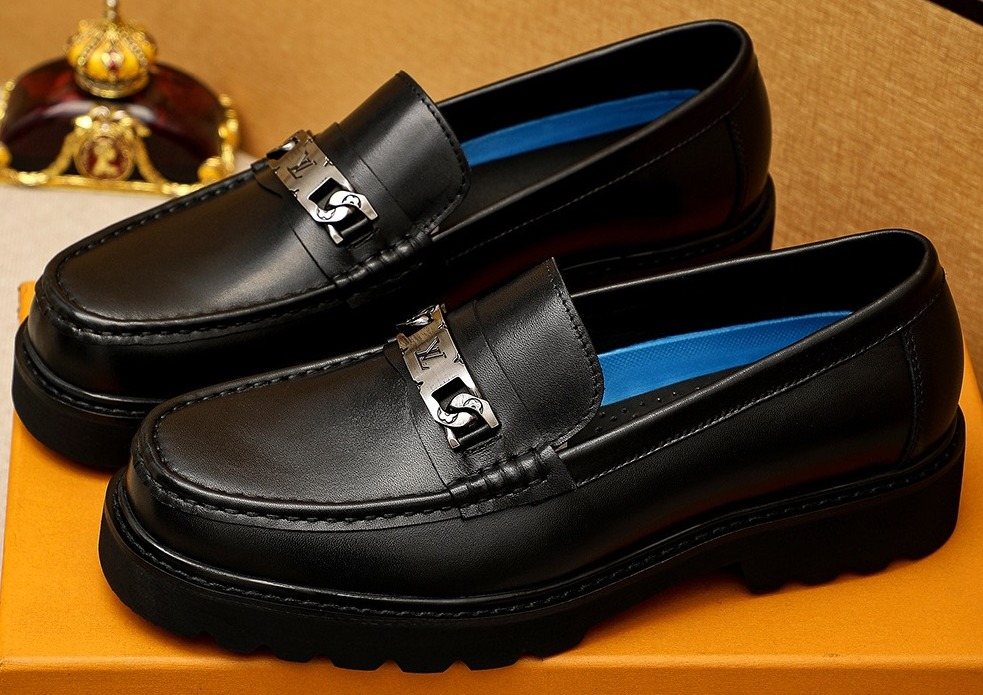 Louis Vuitton Black Metal-Bit Loafers — front