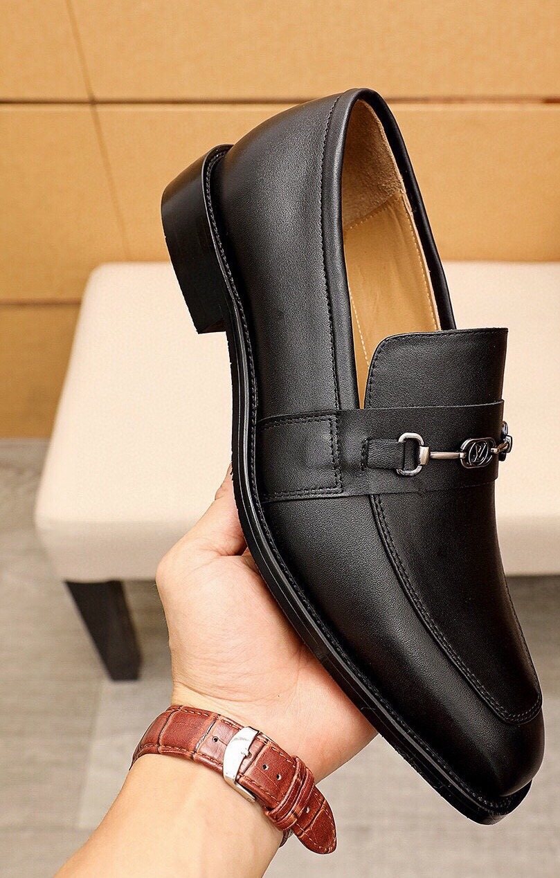 Louis Vuitton Black Metal-Bit Leather Loafers — hero