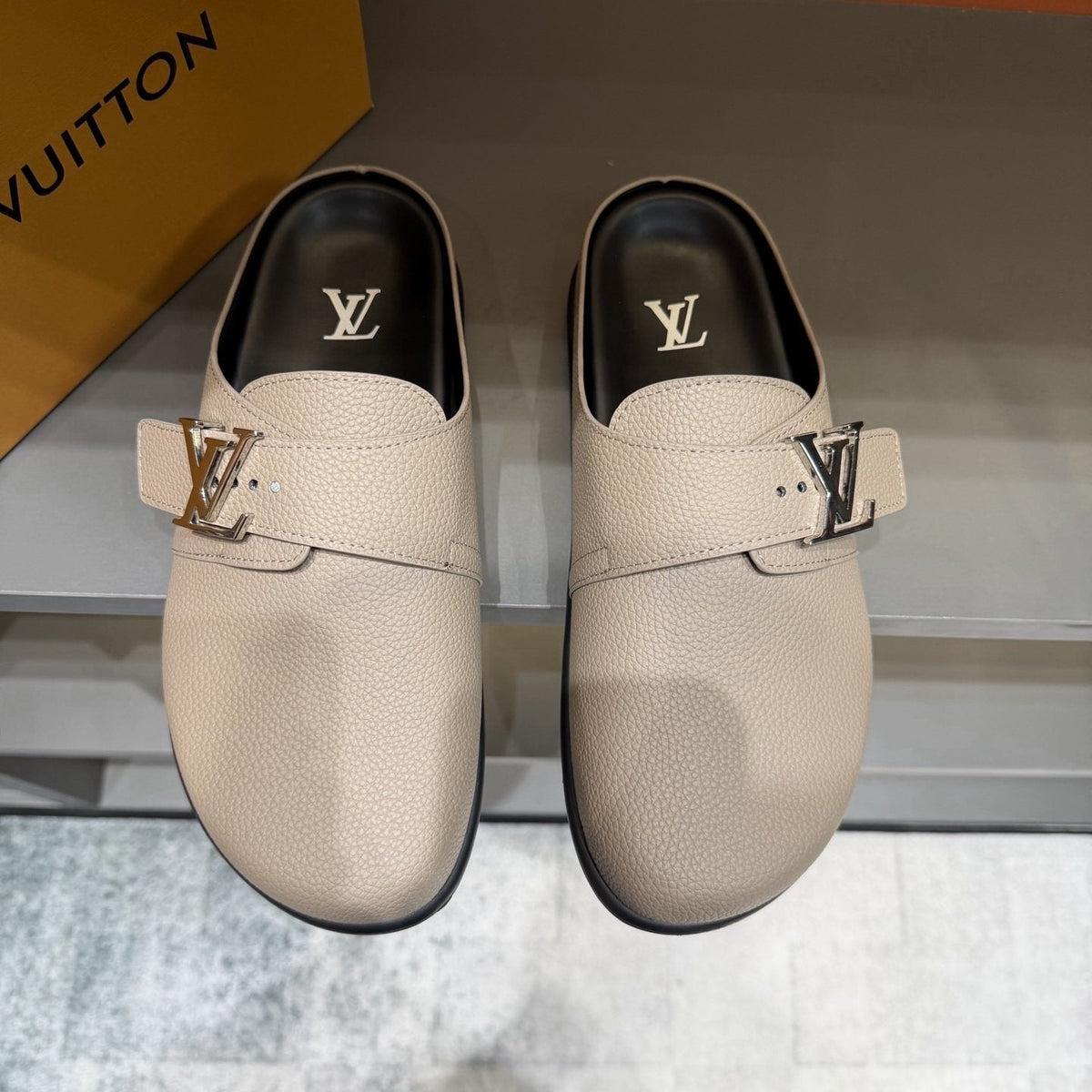 Louis Vuitton Textured Buckle Slide Sandals — front