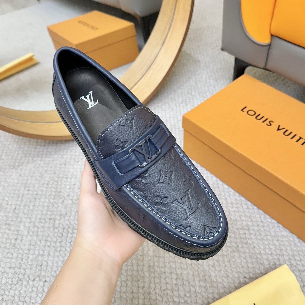 Louis Vuitton Embossed Lug Sole Loafers — front