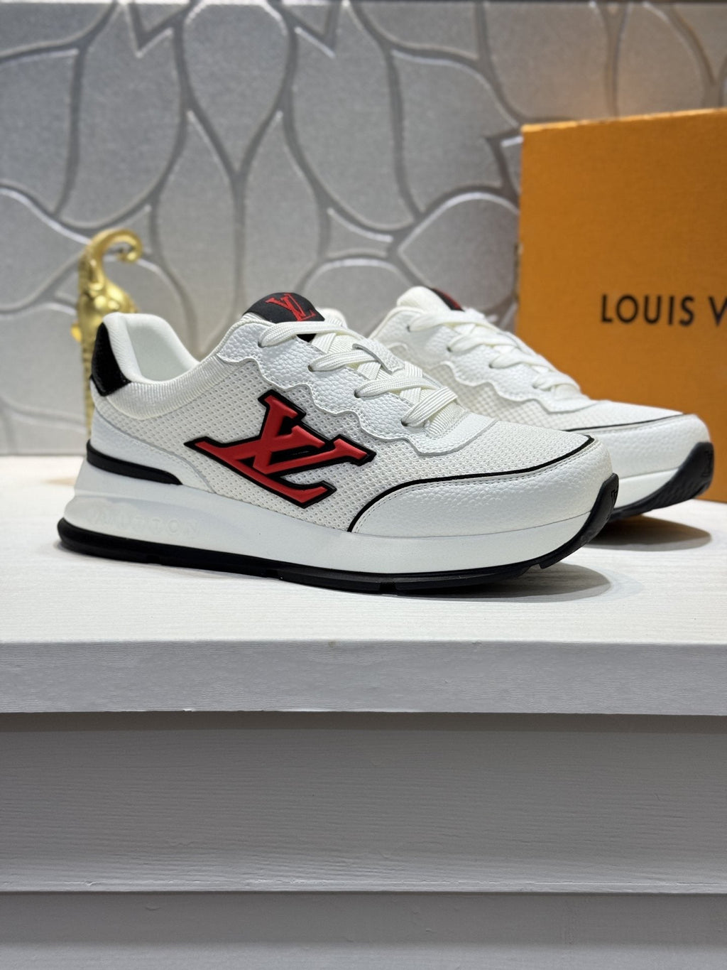Louis Vuitton Low-Top Logo Sneakers — hero