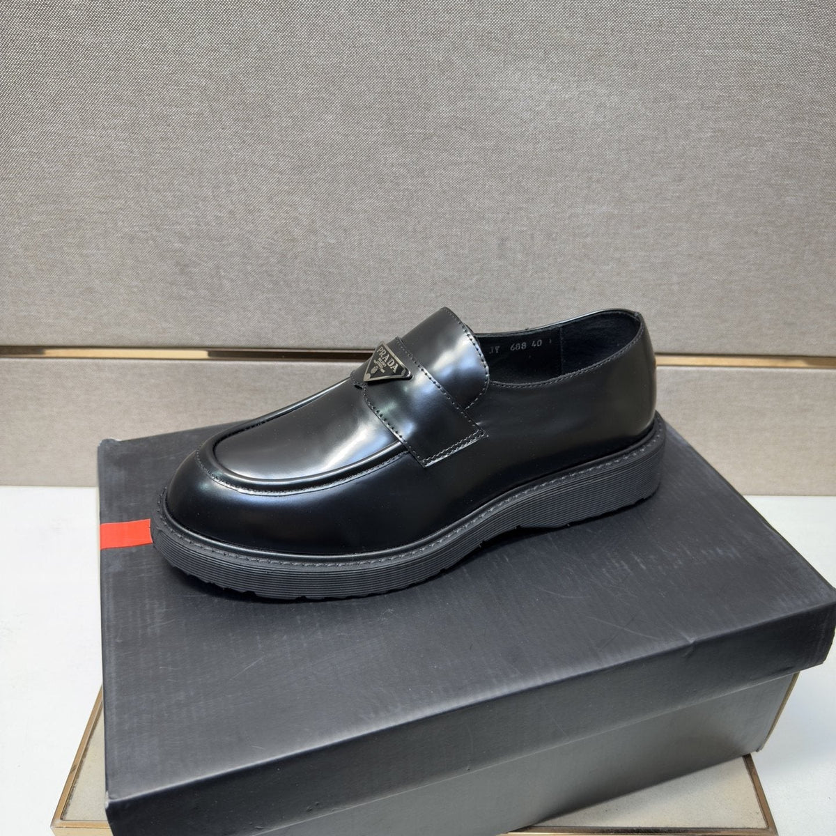 Prada Black Lug Sole Slip-On Shoes — front