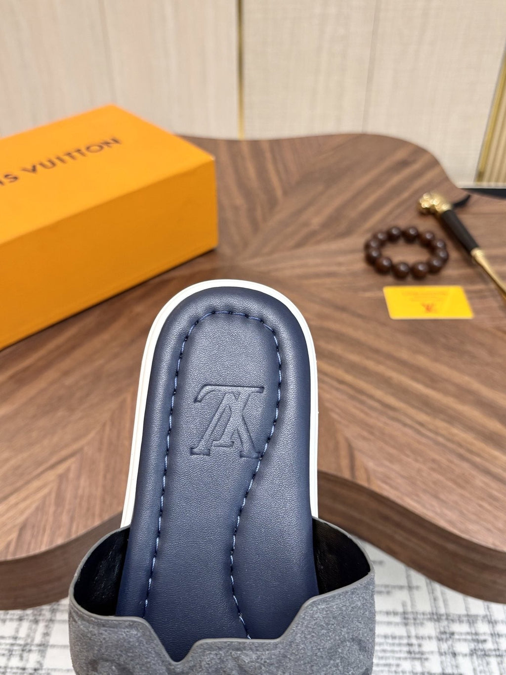 Louis Vuitton Embossed Navy Blue Slide Sandals — side