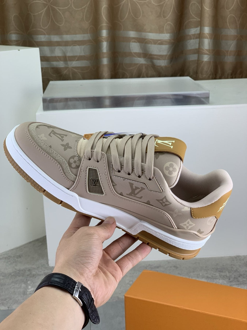 Louis Vuitton Beige, White & Gold Low-Top Sneakers — model