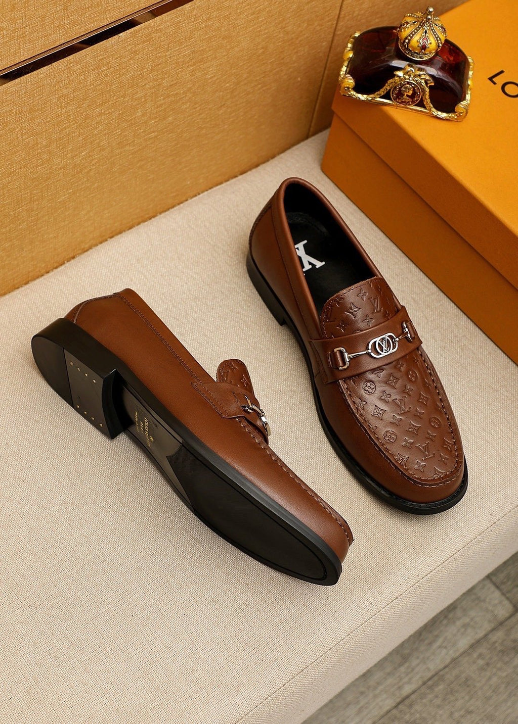 Louis Vuitton Embossed Buckle Loafers — front