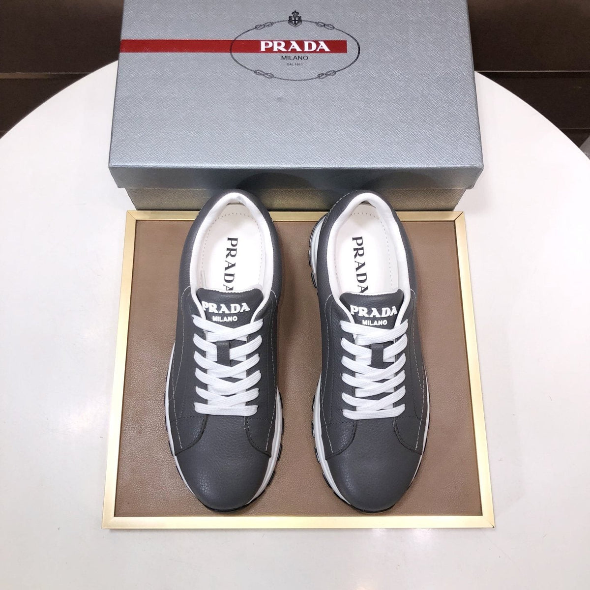 PRADA Black Quilted Low-Top Sneakers — front